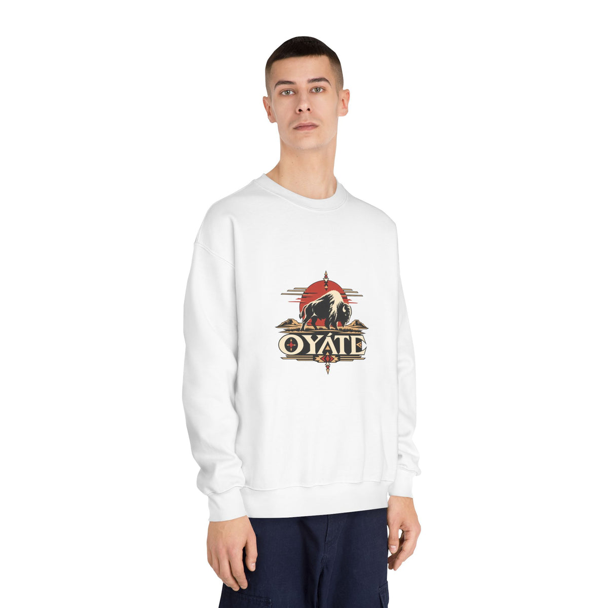 Model wearing the white OYÁTE Dark Buffalo v2 crewneck sweatshirt with dark jeans