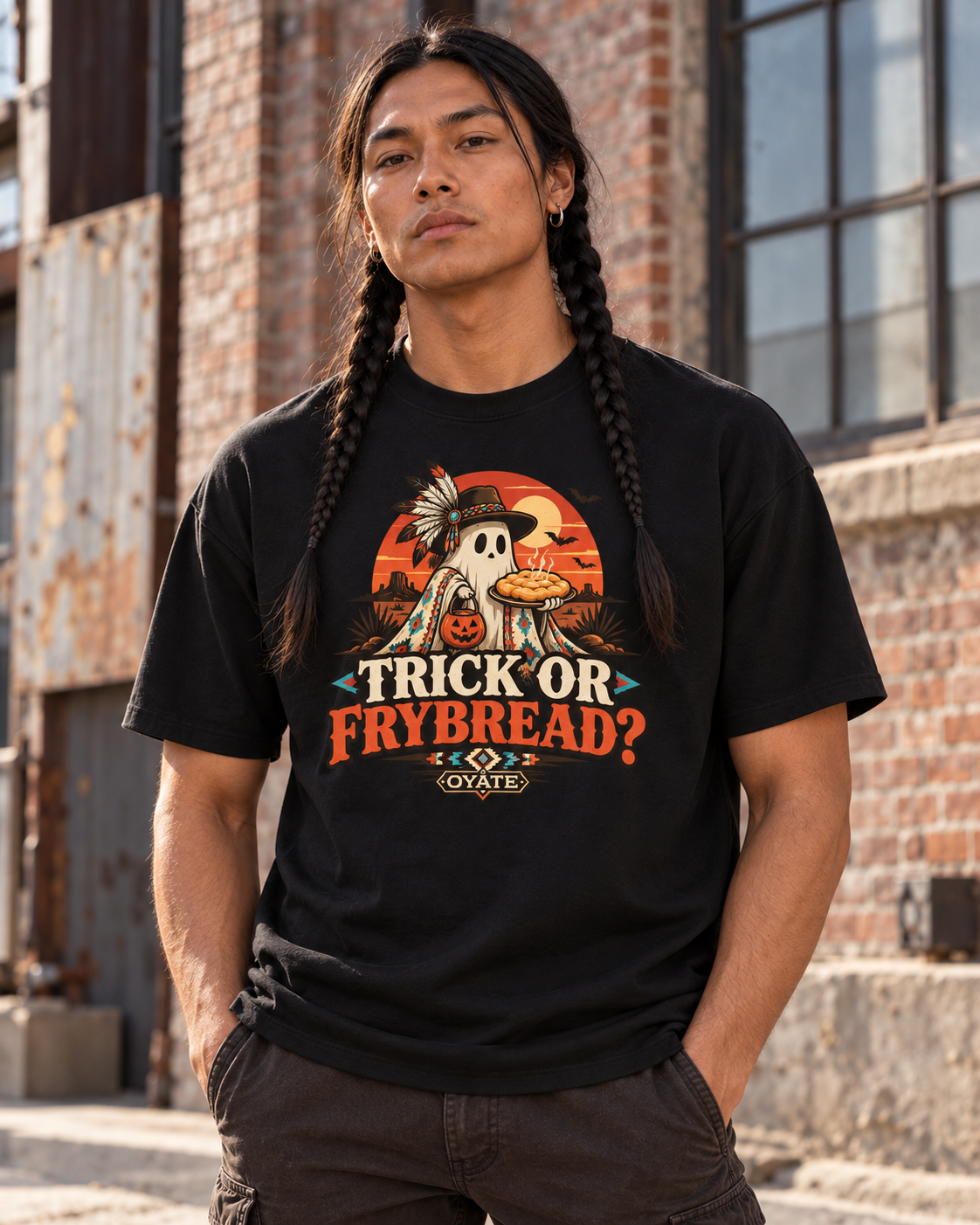 Model wearing black OYÁTE Trick or Frybread Premium Tee in urban scene